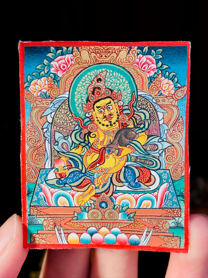Yellow Jambhala Polychrome Miniature Thangka